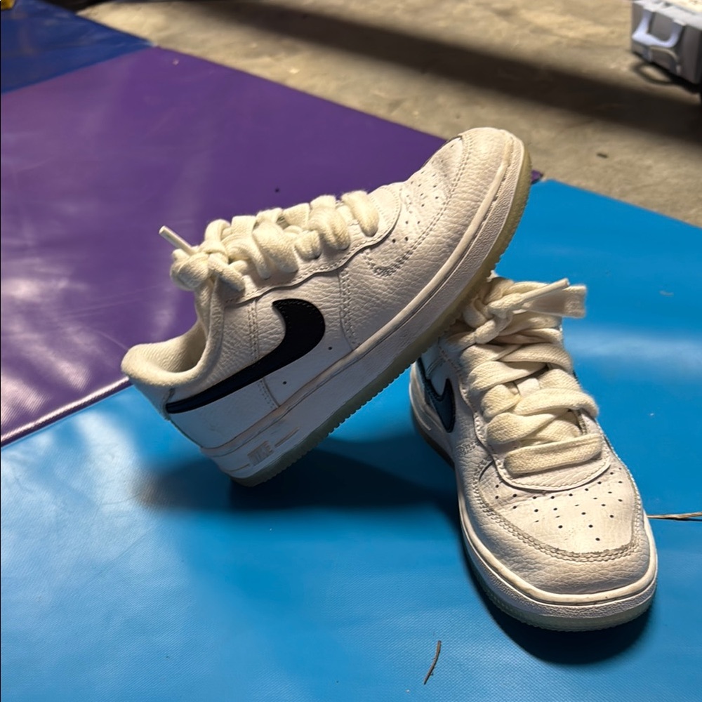 Nike  Air Force ones white/Cream Sneakers with Black Logo